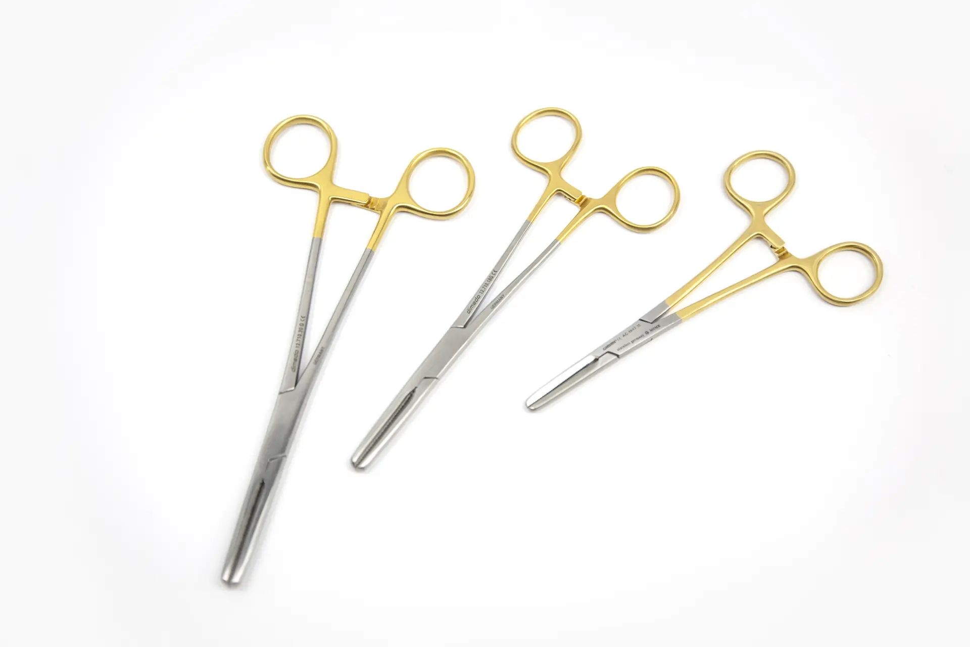 TEMED tubing clamps — gold-handled serrated-jaw clamps for perfusion tubing